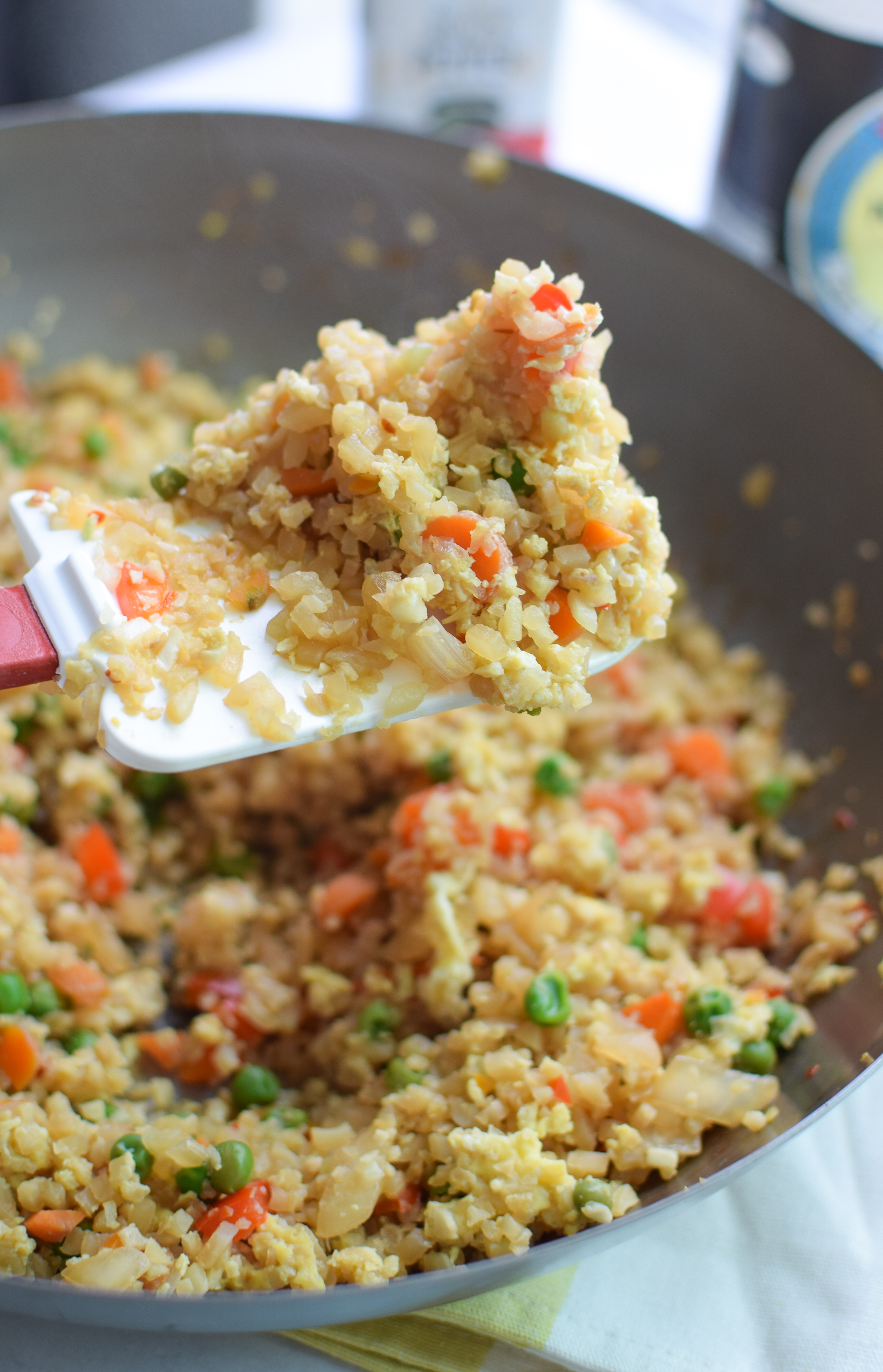 Fried Cauliflower Rice Recipe - Super healthy takeout style fried "rice", made with cauliflower! Packed with veggies and easy to personalize. - ProjectMealPlan.com