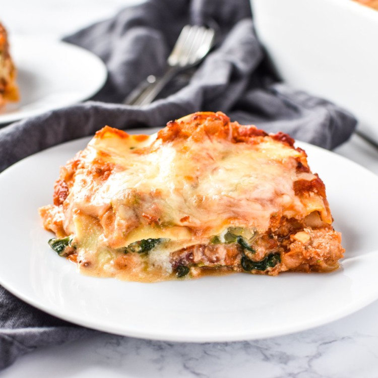 Leftover Vegetable Italian Chicken Lasagna Recipe - Use up leftover veggies in my favorite deliciously layered ground chicken lasagna! - ProjectMealPlan.com