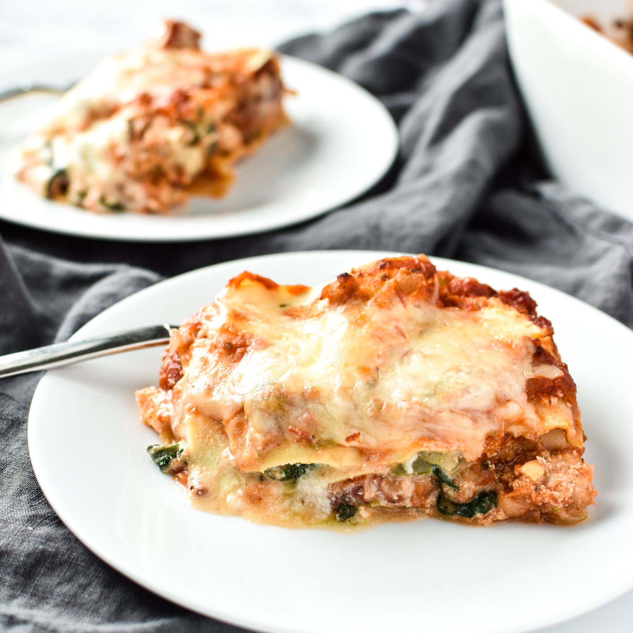 Leftover Vegetable Italian Chicken Lasagna Recipe - Use up leftover veggies in my favorite deliciously layered ground chicken lasagna! - ProjectMealPlan.com