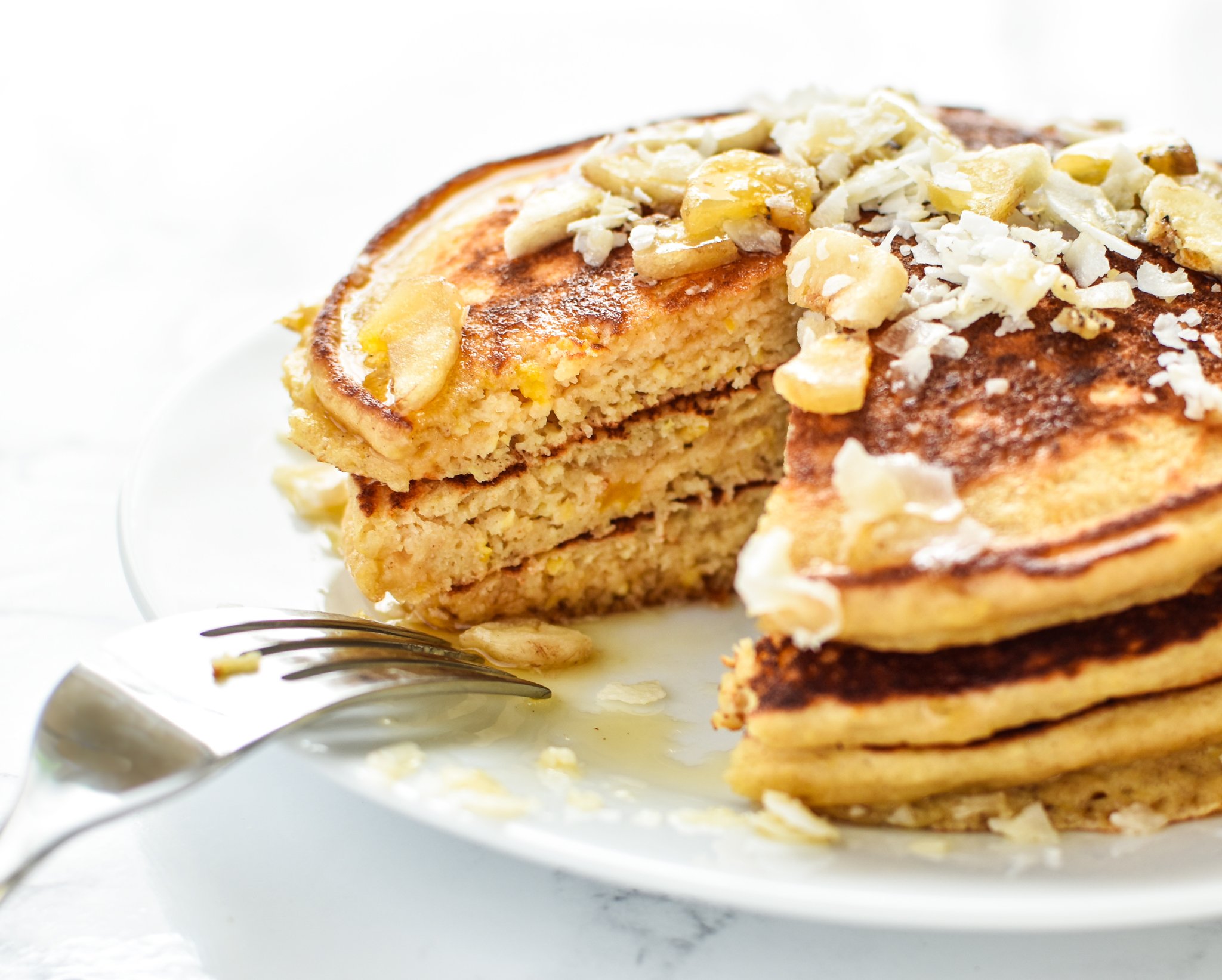 Tropical Pineapple Protein Pancakes Recipe - A perfect blend of pineapple helps keep these delicious protein pancakes moist and perfect for on-the-go! - ProjectMealPlan.com