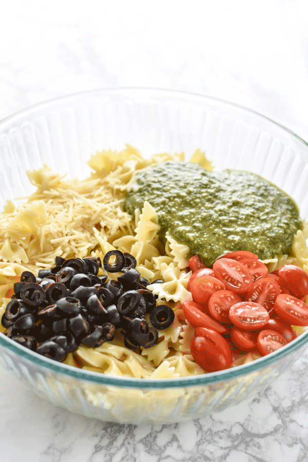 A GIF of mixing up the Incredibly Easy Pesto Pasta Salad - just 6 simple ingredients for the best make-ahead side dish! - ProjectMealPlan.com