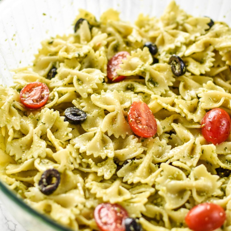 A big delicious bowl of Incredibly Easy Pesto Pasta Salad - just 6 simple ingredients for the best make-ahead side dish! - ProjectMealPlan.com