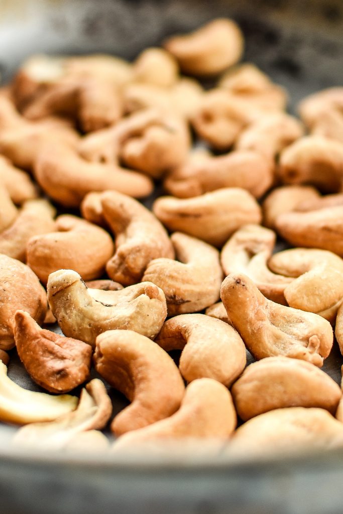 toasting cashews in a pan.