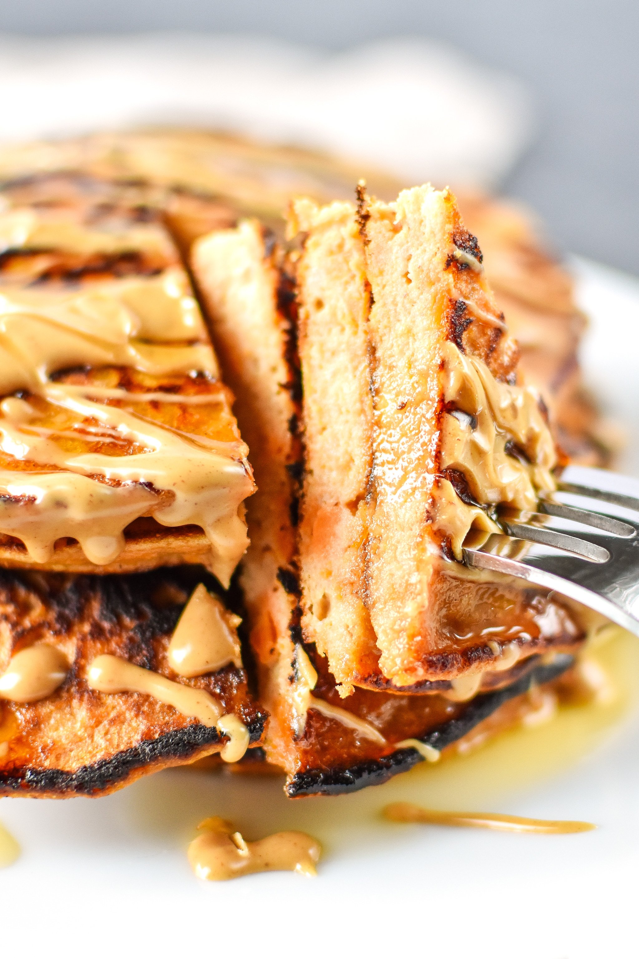 5-Ingredient Sweet Potato Banana Pancakes - Banana, sweet potato, nut butter, eggs and cinnamon are all you need to make these simple pancakes happen! - ProjectMealPlan.com