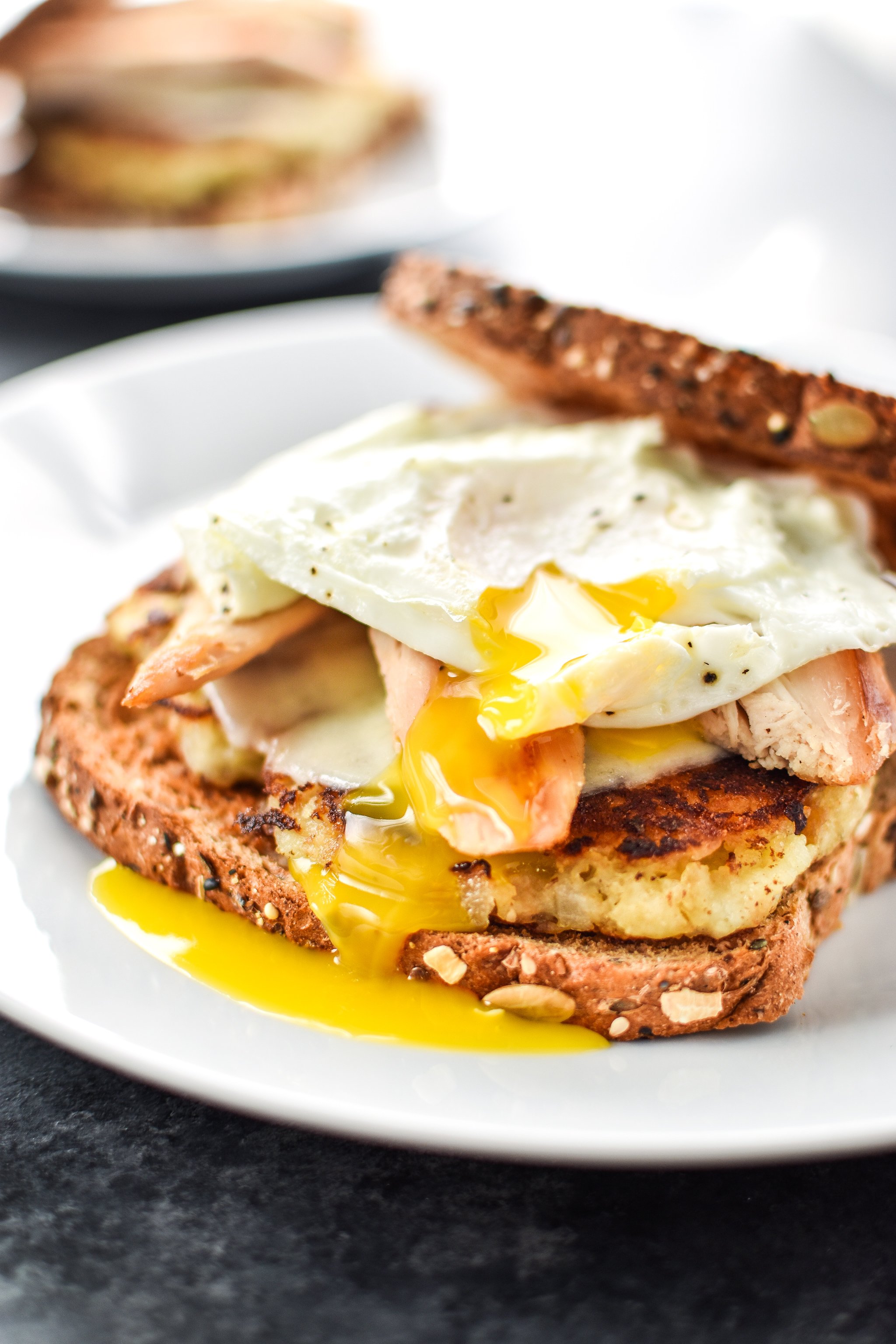 Ultimate Leftover Turkey Breakfast Sandwich on a white plate