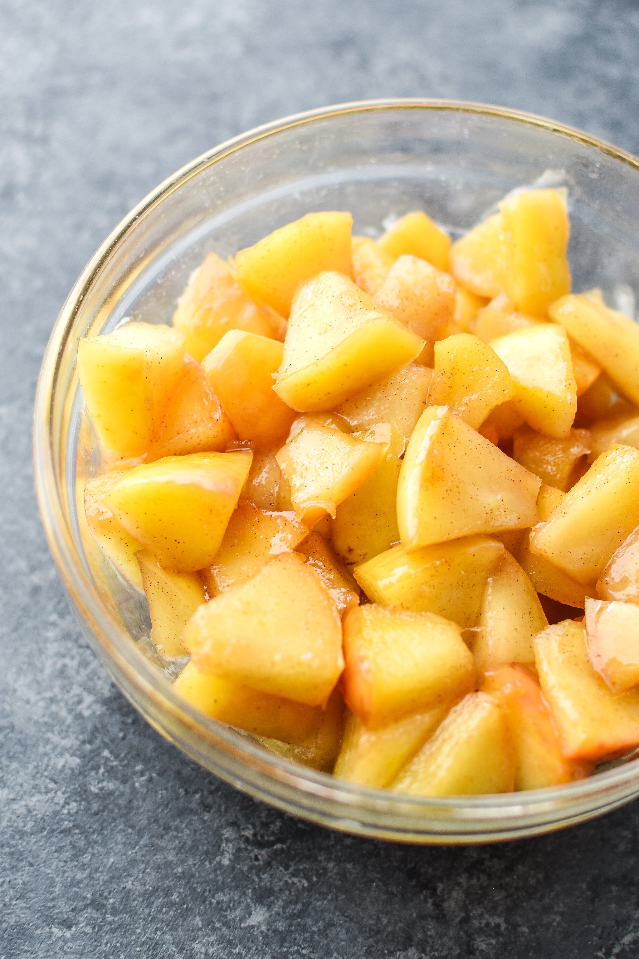 Sauteed apples with honey and cinnamon in a bowl.