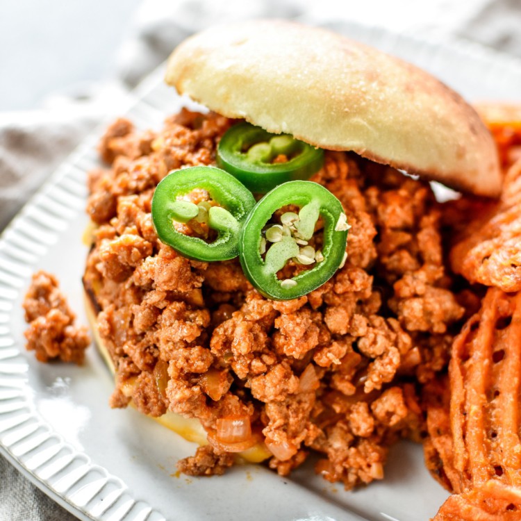 Turkey sloppy joe on a bun with jalapeno.