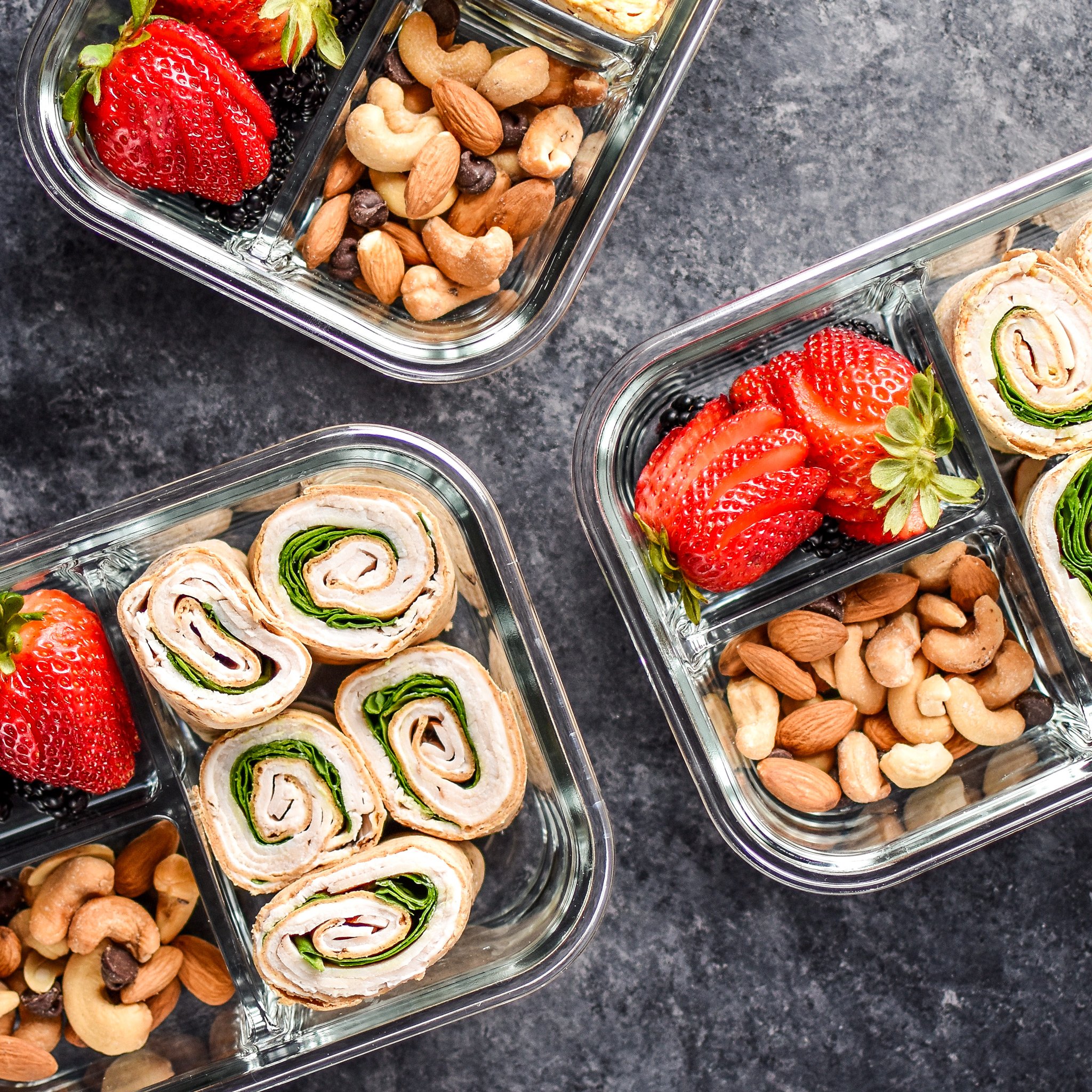 Turkey pinwheels are an excellent no heat lunch option. Served here with nuts and fruit.
