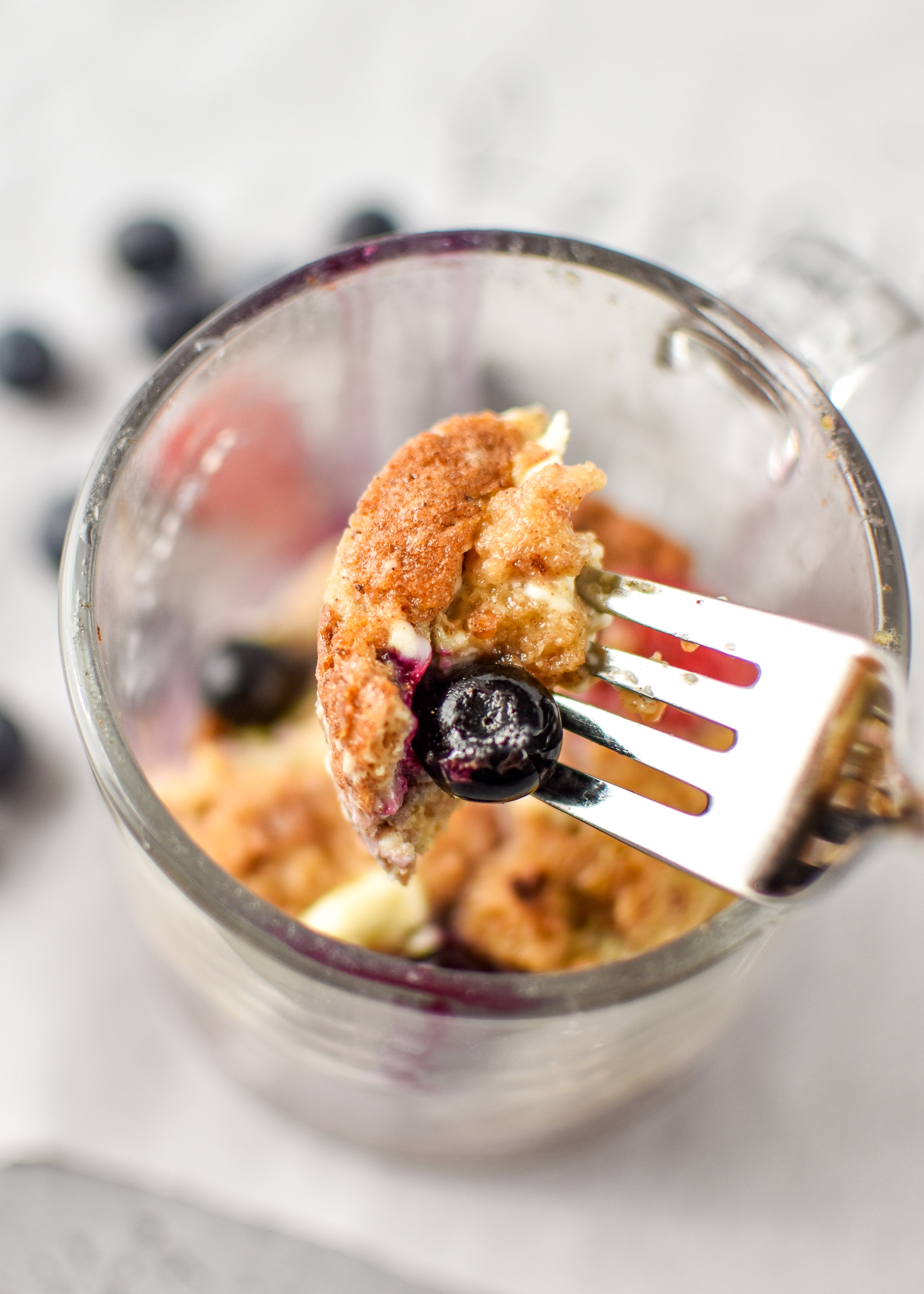 Taking a bite of the berries & cream flavor of microwave mug french toast