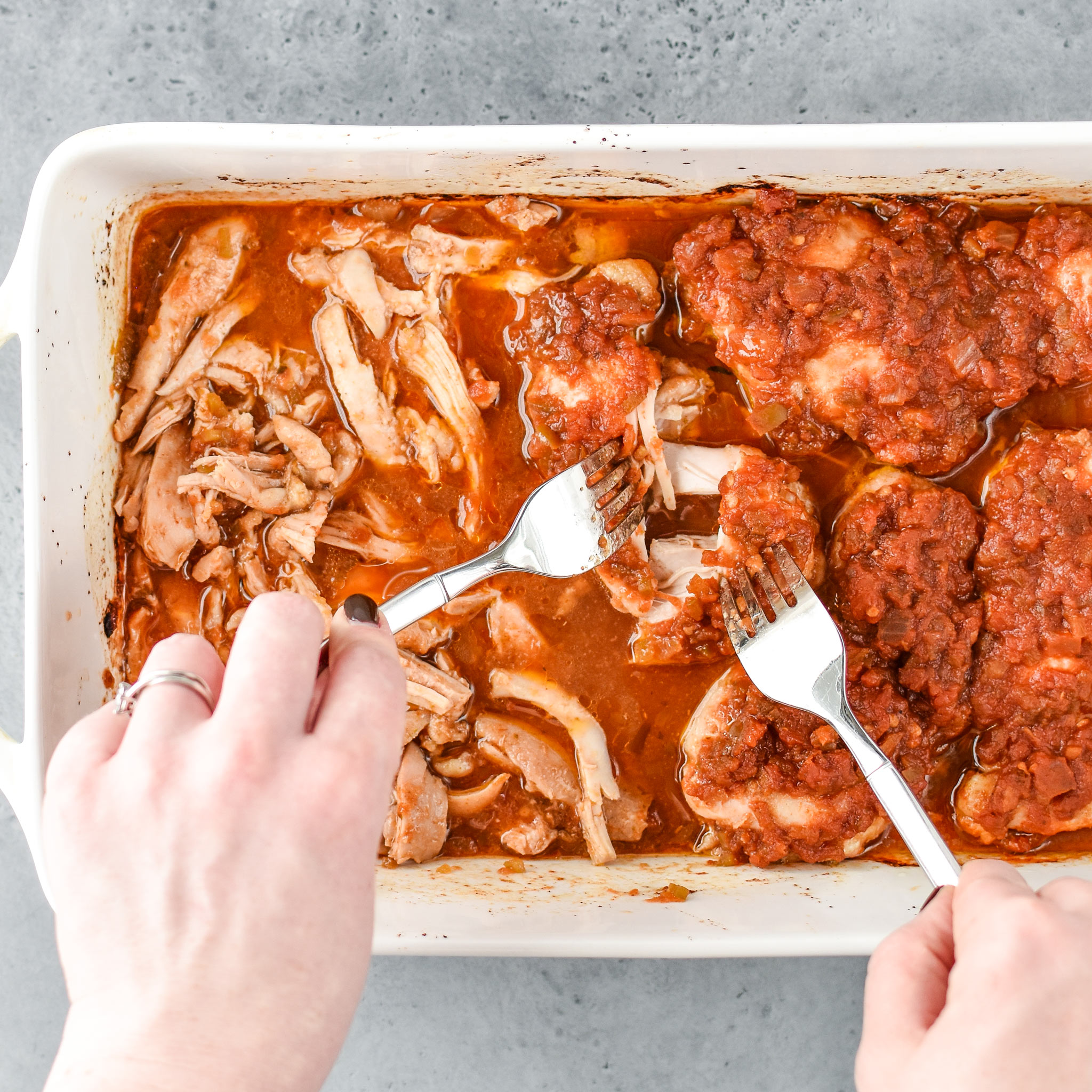 Baked Salsa Chicken Thighs being shredded