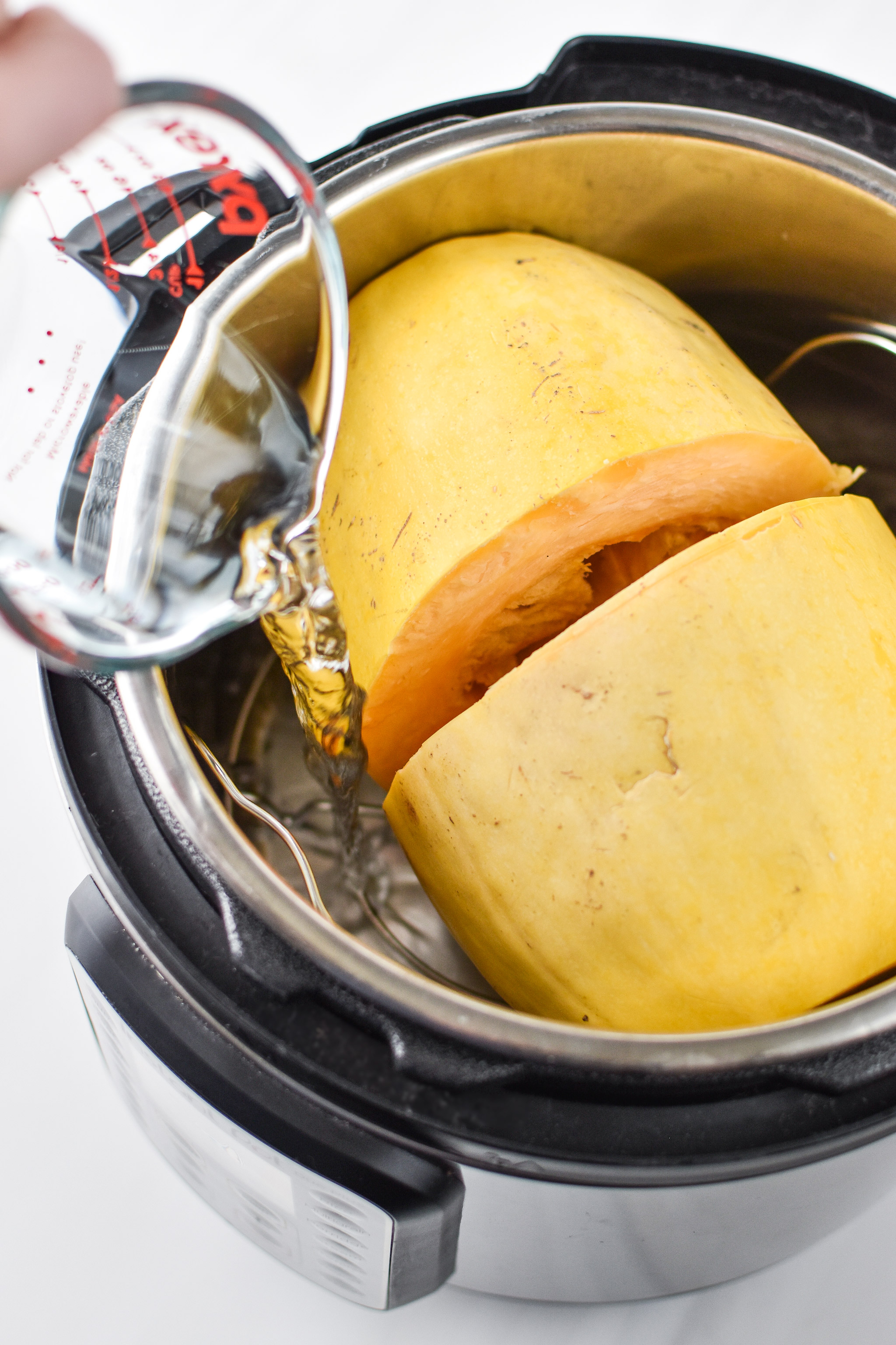 Cooking a spaghetti squash in the Instant Pot for the Whole30 Chicken Bacon Ranch Casserole.