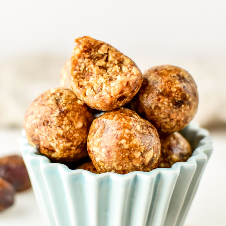 peanut butter cookie balls stacked in a cup.