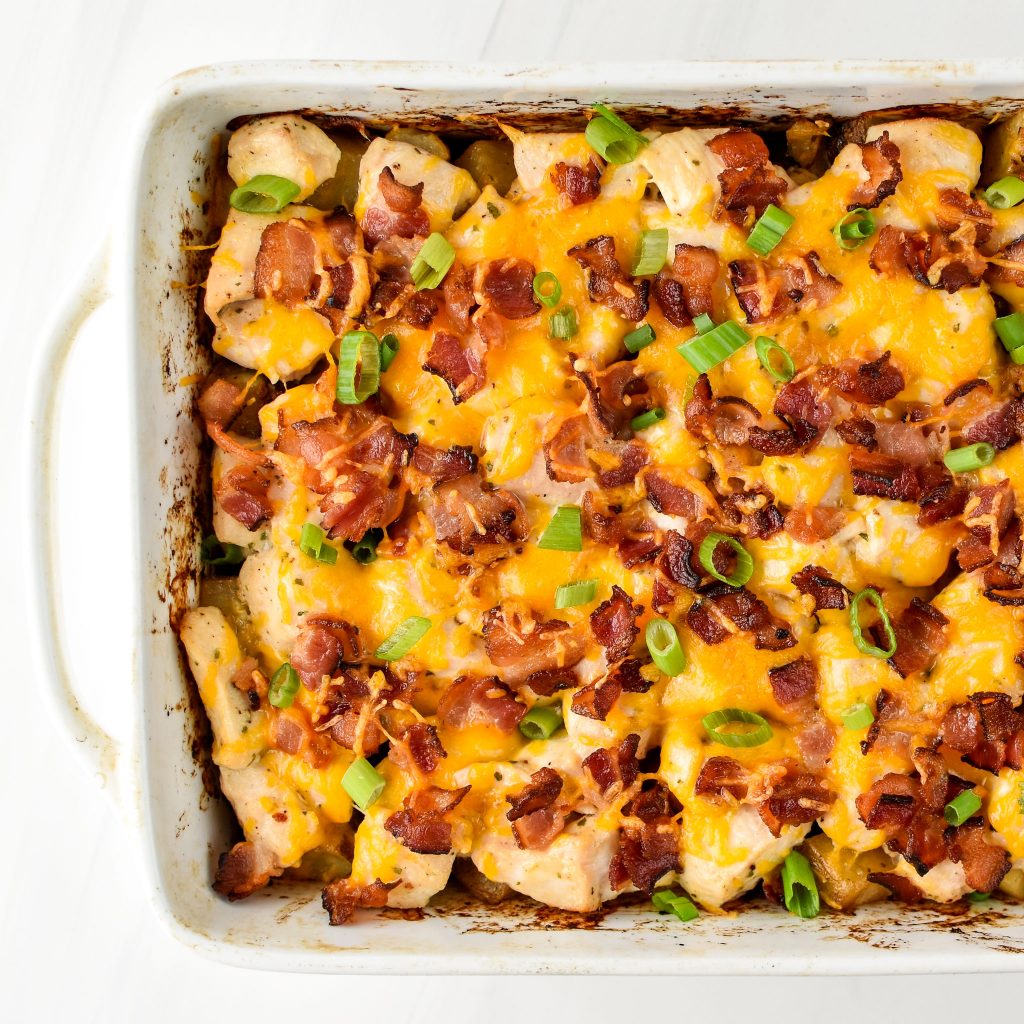 Chicken bacon ranch potato bake fresh from the oven in a rectangular dish.