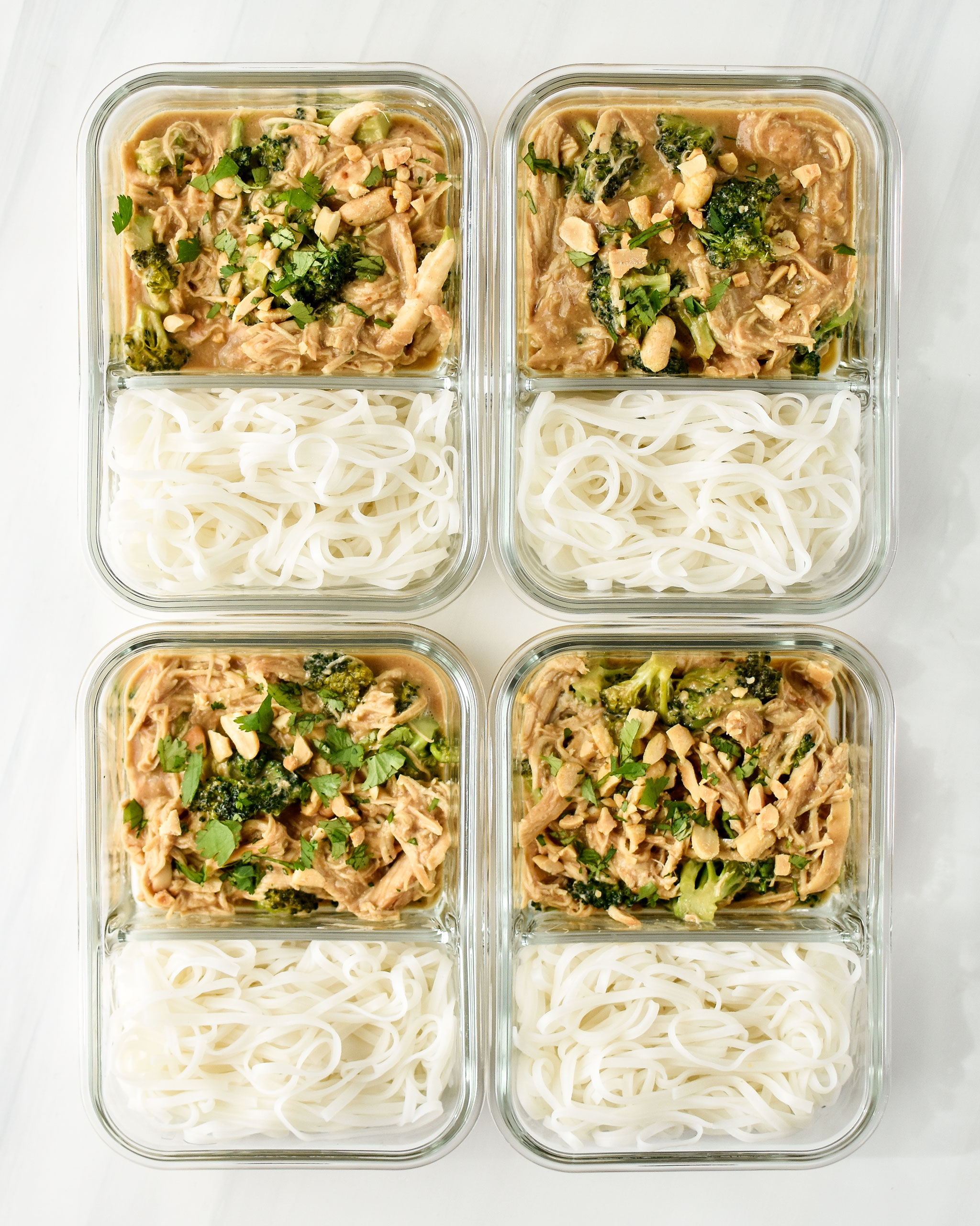 slow cooker peanut chicken noodle meal prep pictured in glass meal prep containers
