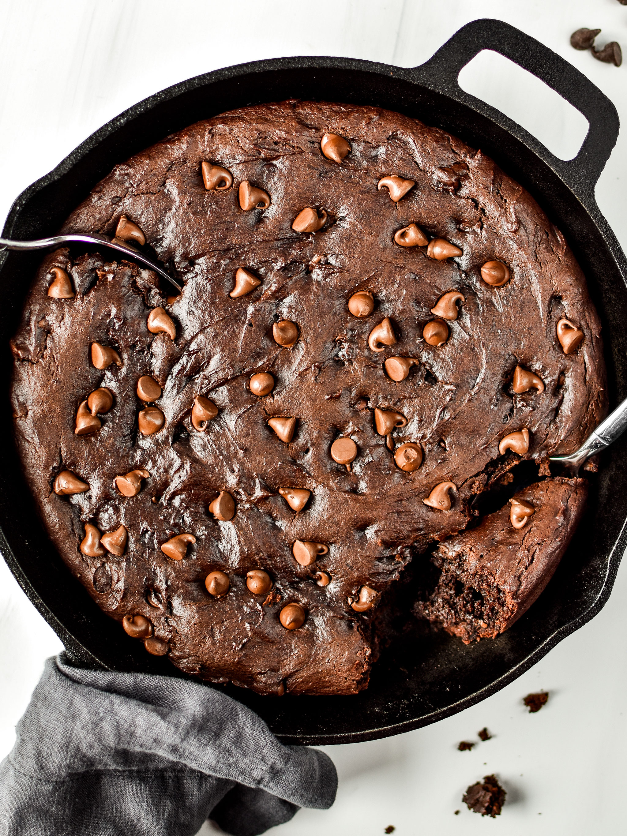 Sweet potato brownie skillet pictured from above with two spoons digging in