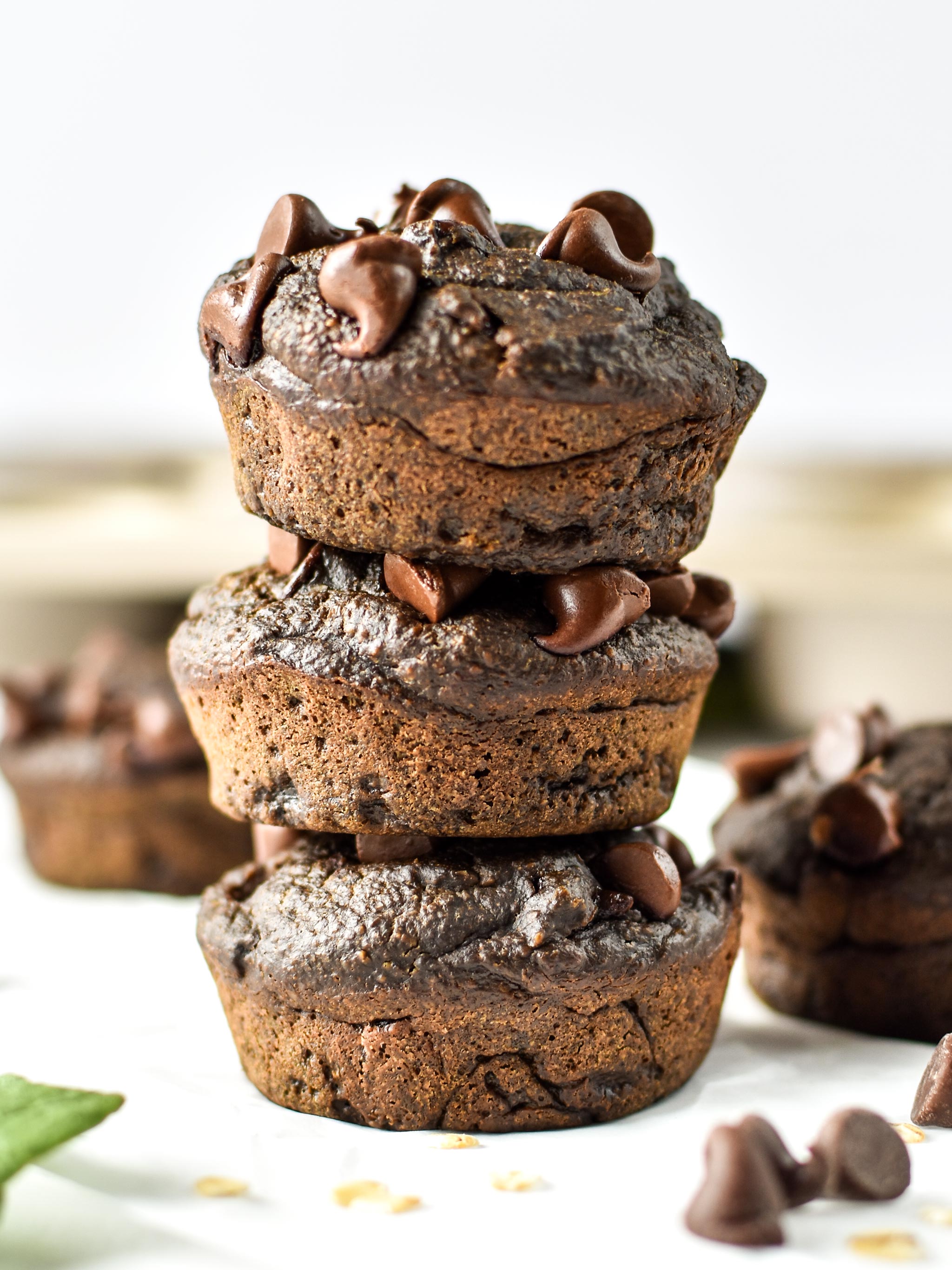 chocolate spinach blender muffins stacked with chocolate chips