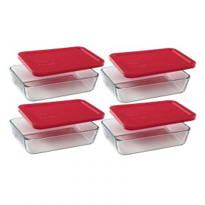 3 cup glass pyrex containers with red lids.