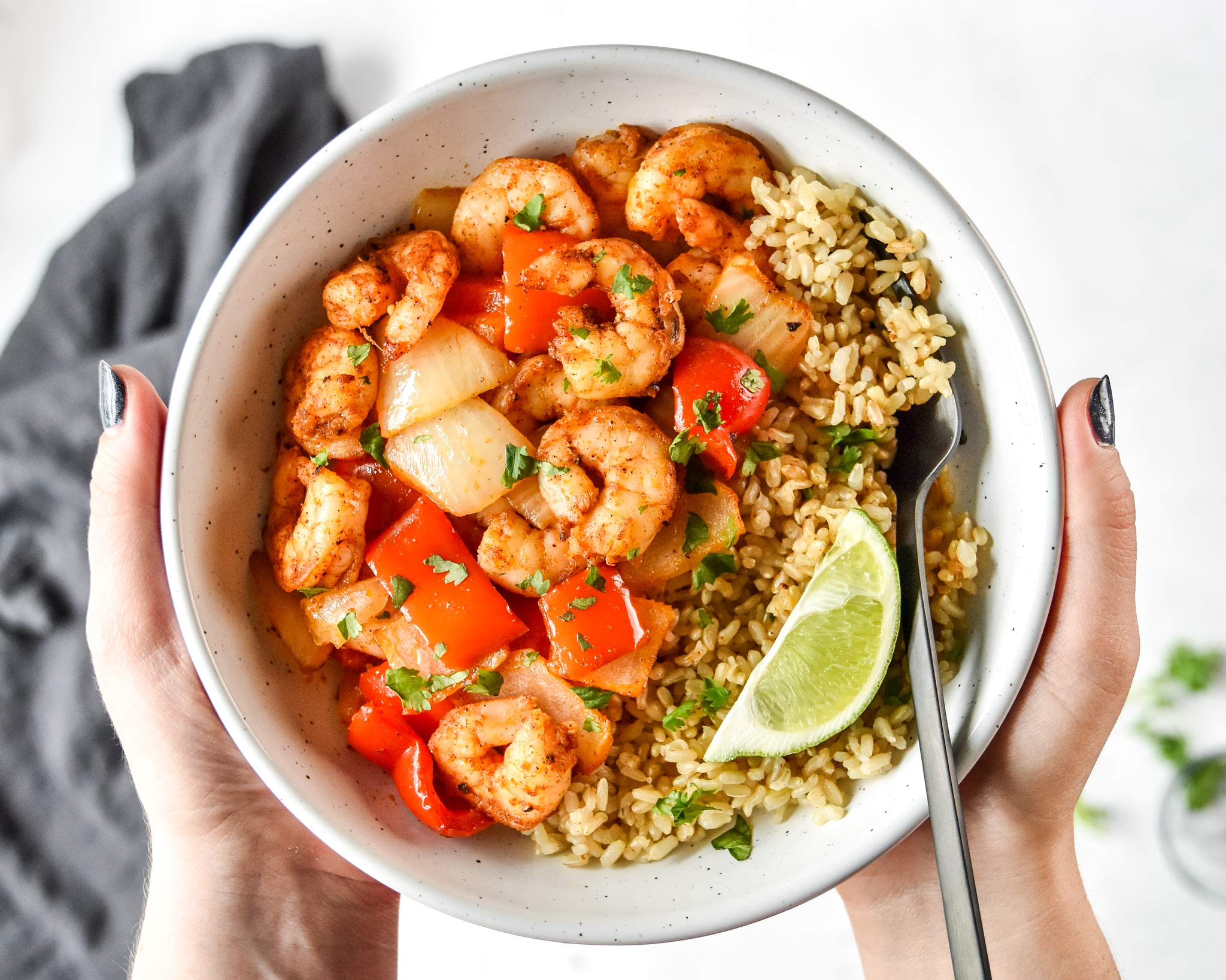 easy air fryer shrimp and vegetables served with rice and a lime wedge