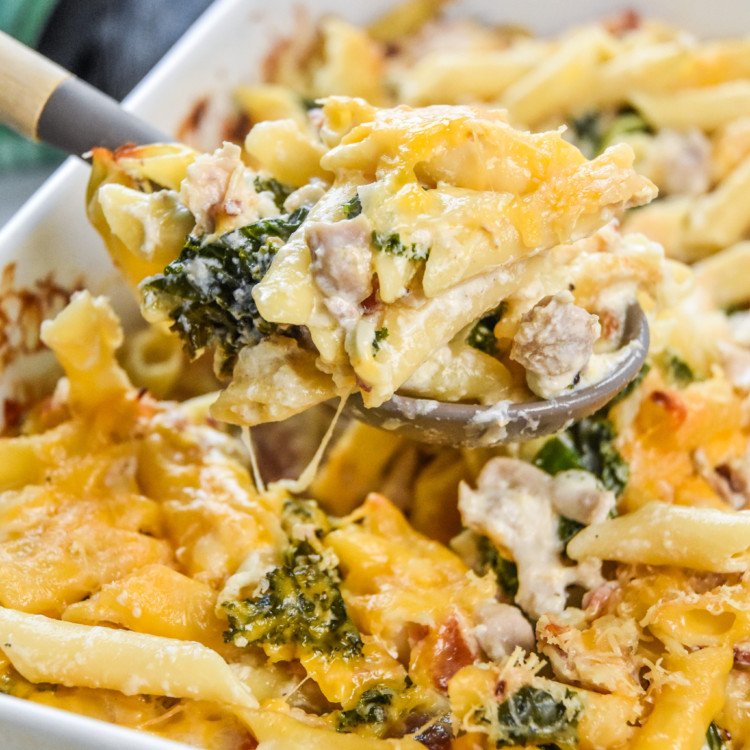 a scoop of fresh made cheesy chicken bacon ranch kale casserole