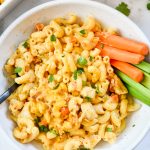 buffalo chicken mac and cheese in a bowl with a fork