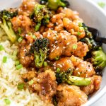 air fryer trader joes orange chicken and broccoli close up with a fork