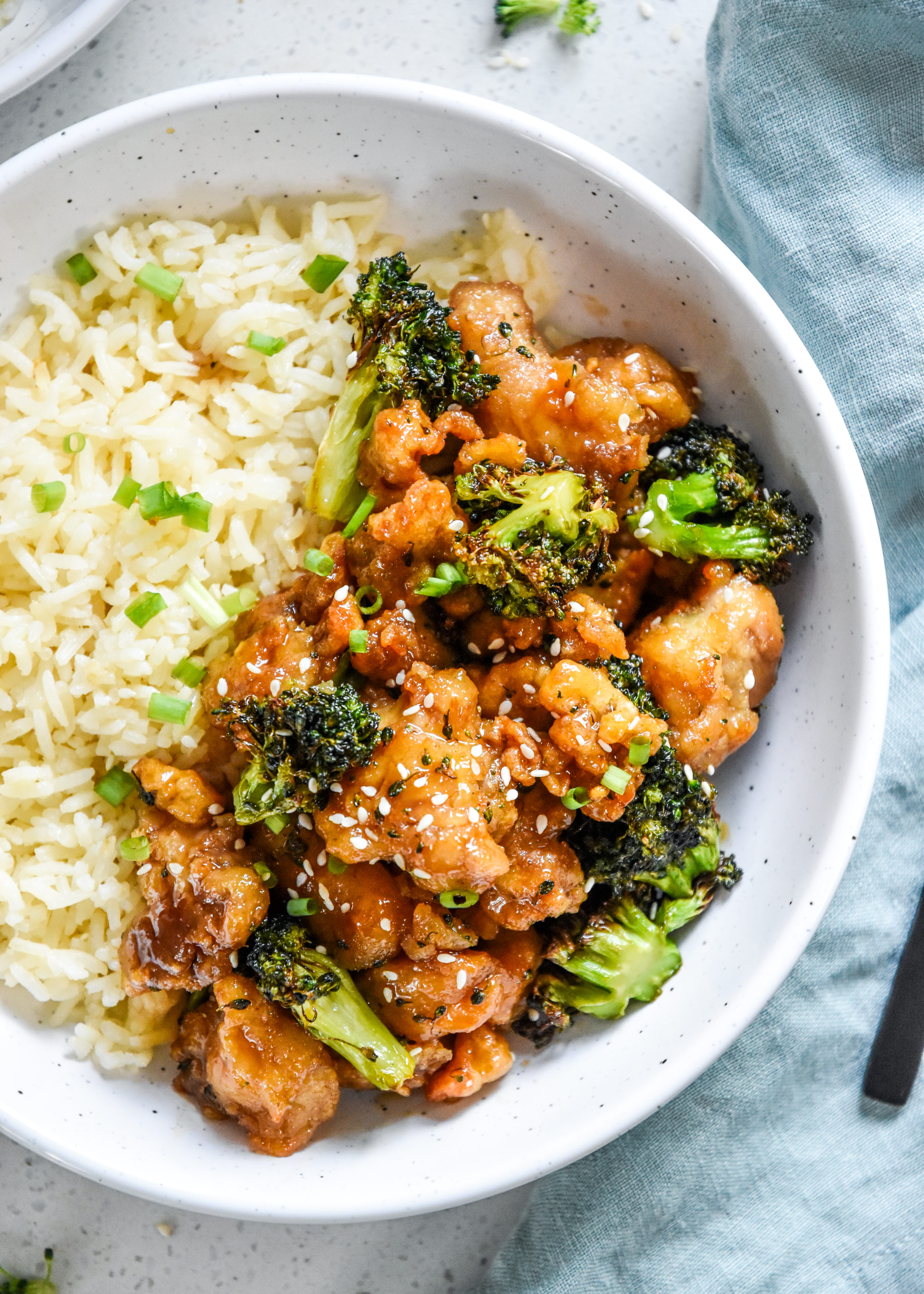 air fryer trader joes orange chicken and broccoli dinner plated with rice