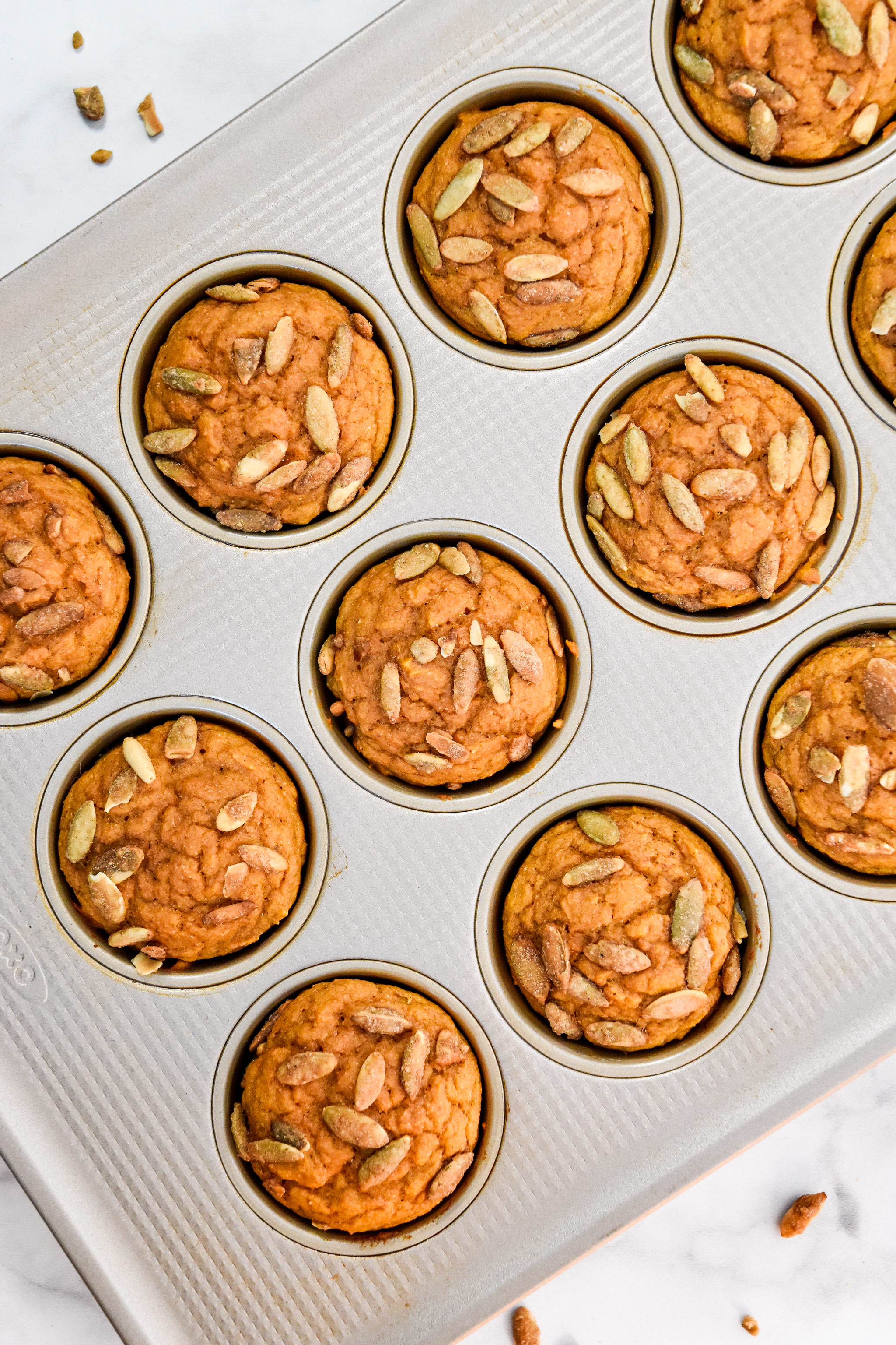 fresh baked pumpkin spice pancake mix muffins cooling in the muffin tin