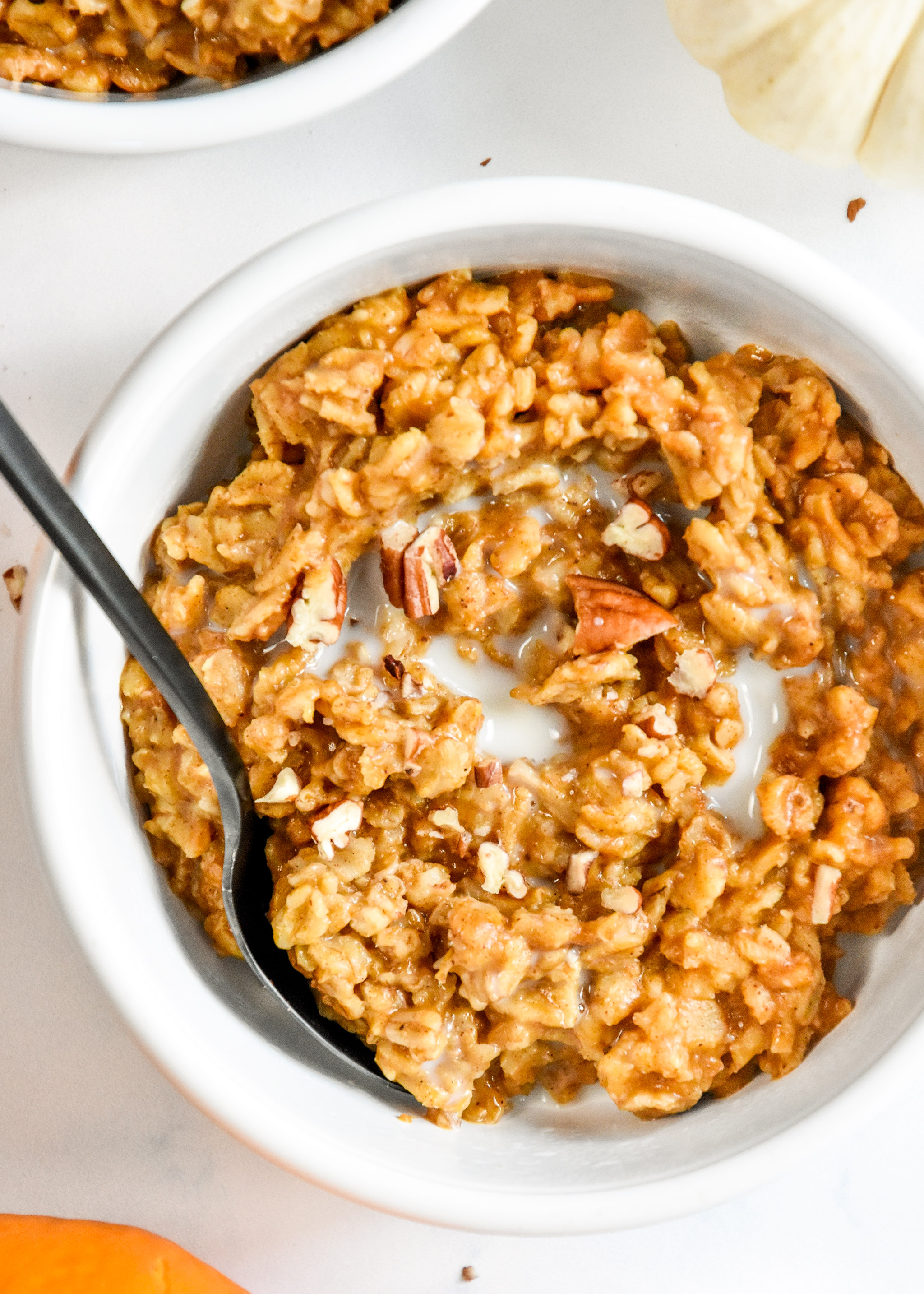 bowl of instant pot pumpkin spice oatmeal with some almond milk