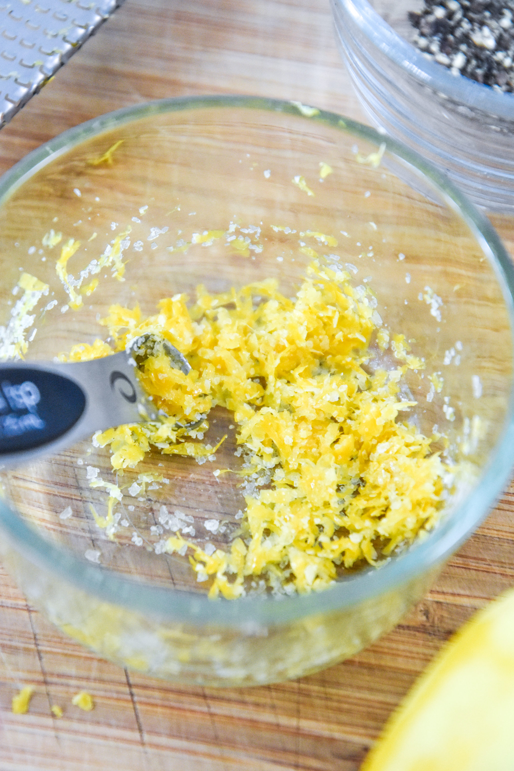 lemon zest and salt in a bowl for the lemon pepper salmon recipe.