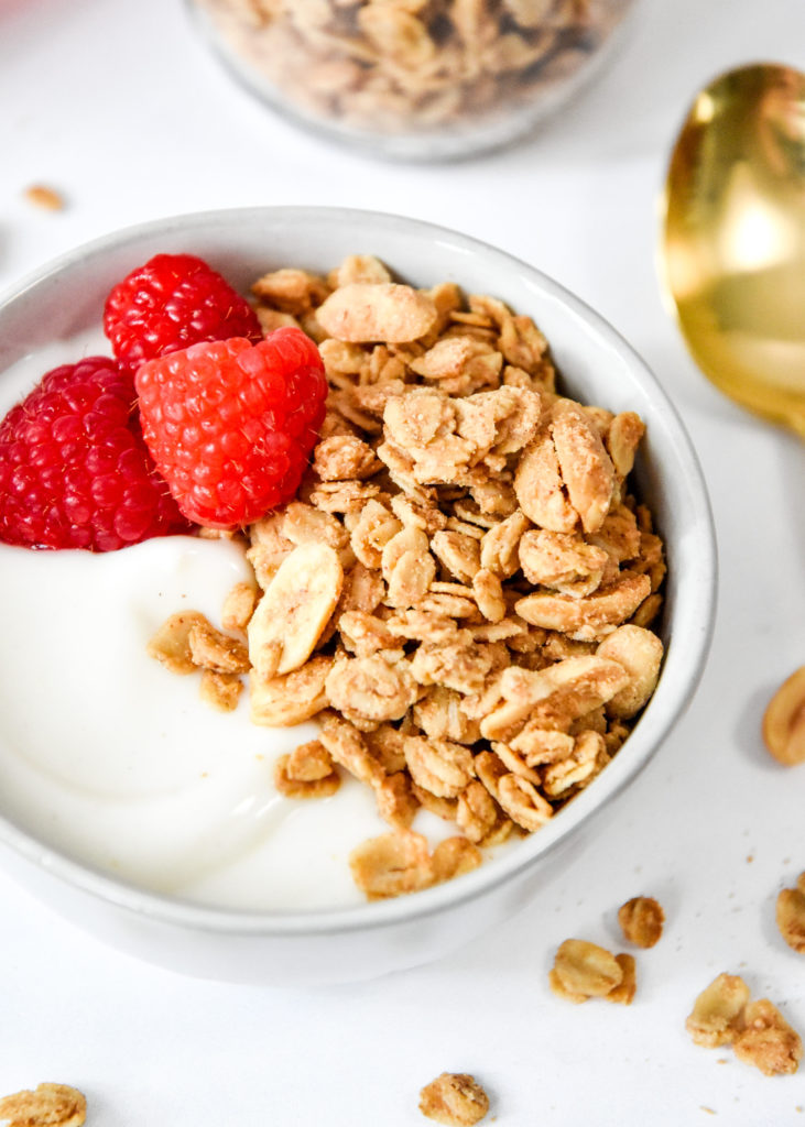 easy peanut butter granola with raspberries and yogurt.