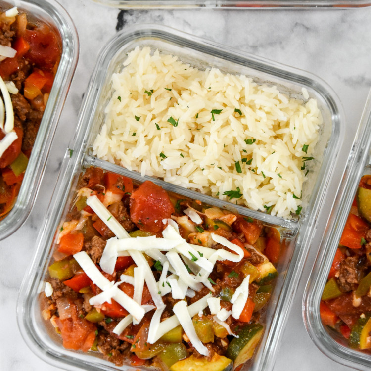 meal prep unstuffed pepper bowls with cheese on top in a glass container.
