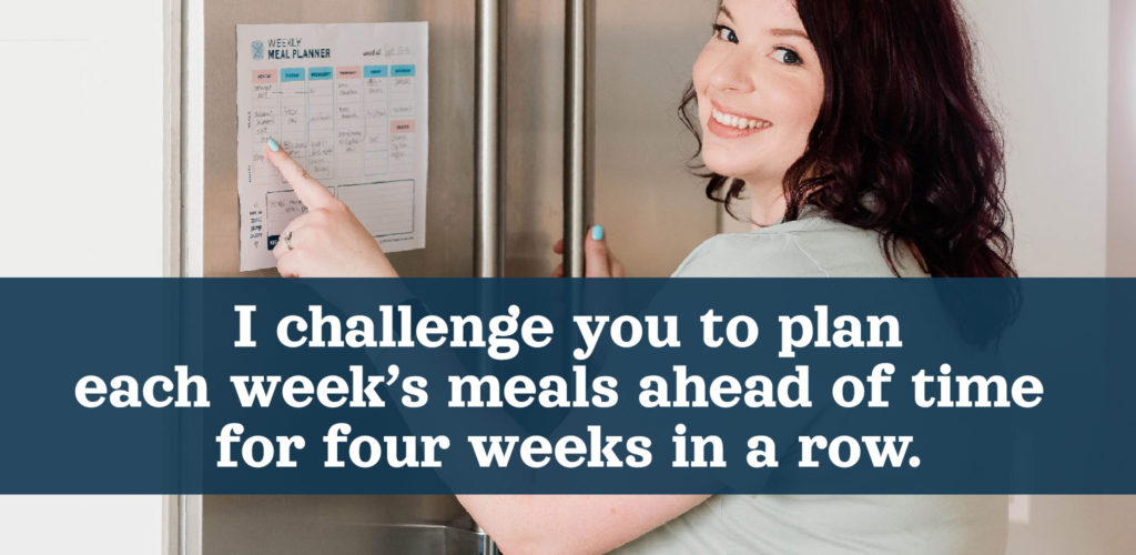 dark haired woman pointing at meal plan on fridge.