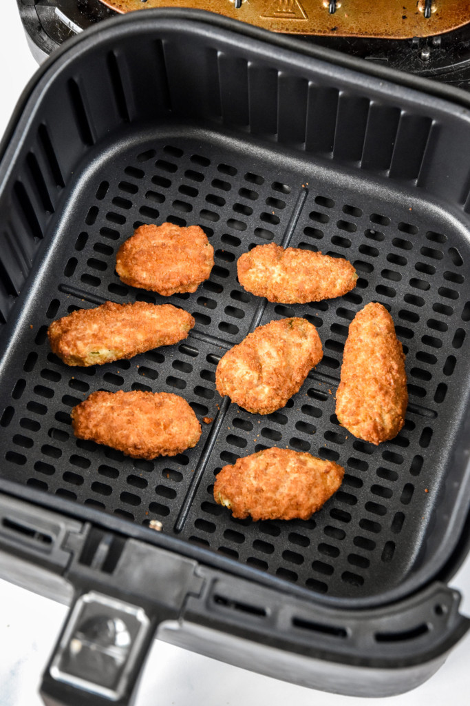 cooked jalapeno poppers in an air fryer for article how to cook frozen appetizers in an air fryer.
