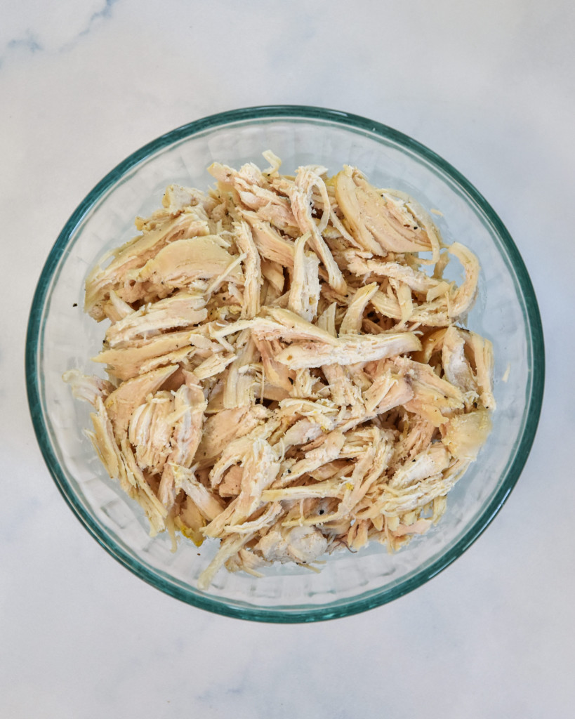 a bowl of shredded chicken for meal prep.