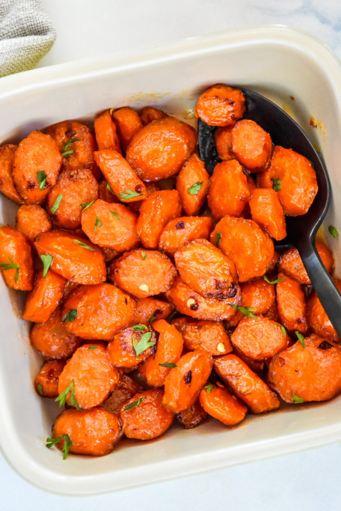 air fryer hot honey glazed carrots in a square serving dish.