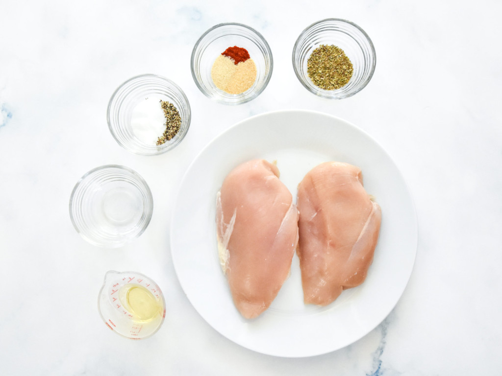 ingredients on a surface to make the juicy air fryer boneless chicken breasts.