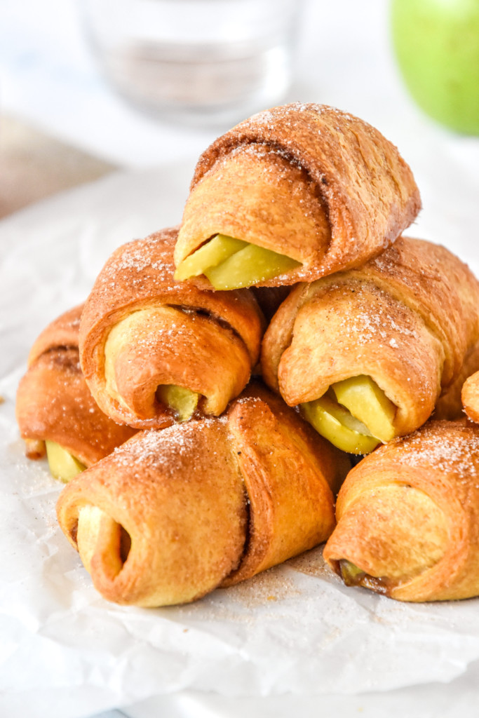 stack of air fryer apple pie crescent rolls with cinnamon sugar on top.