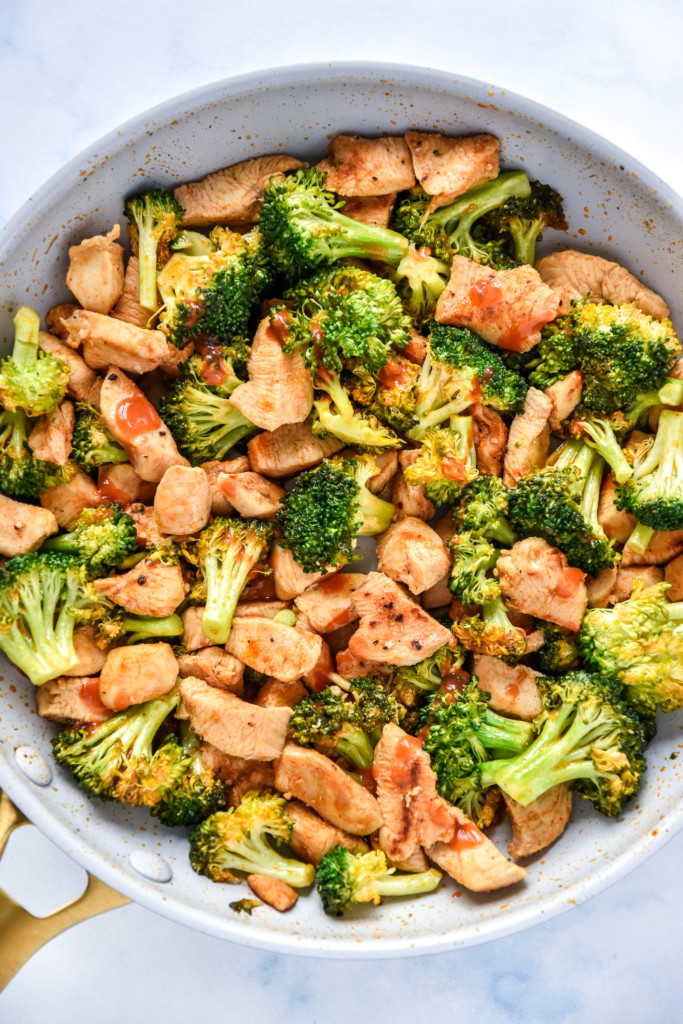 cooked skillet of buffalo chicken and broccoli.