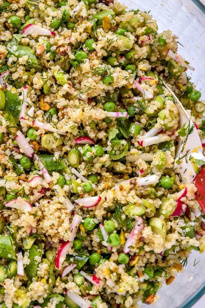 herbs and nuts stirred into the spring vegetable quinoa salad.