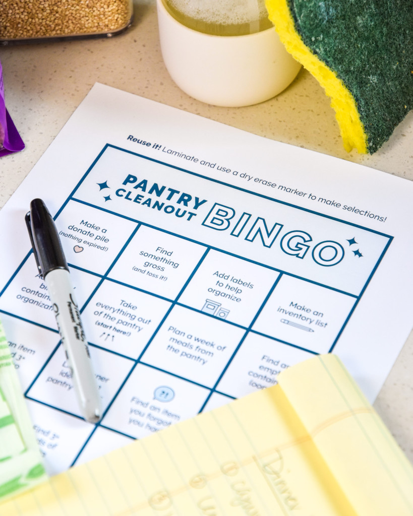 pantry cleanout bingo sheet with pantry cleaning supplies.