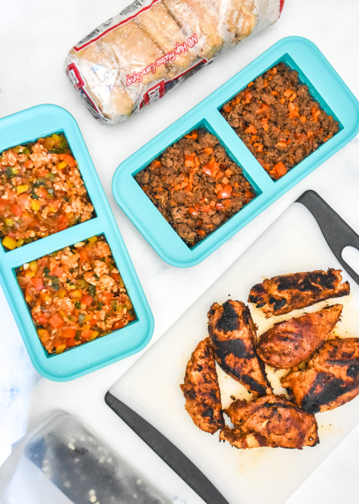 recipes made for the freezer including chicken on a cutting board and meals in a souper cubes tray.