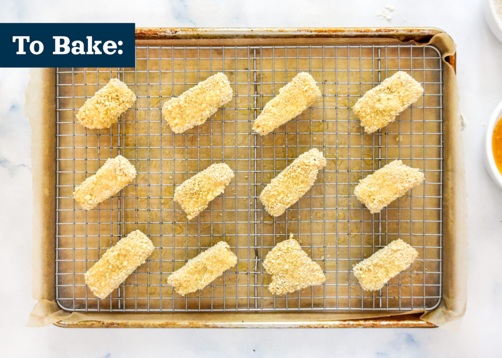 to bake the freezer-friendly homemade fish sticks, place on a lined sheet pan with a metal rack.