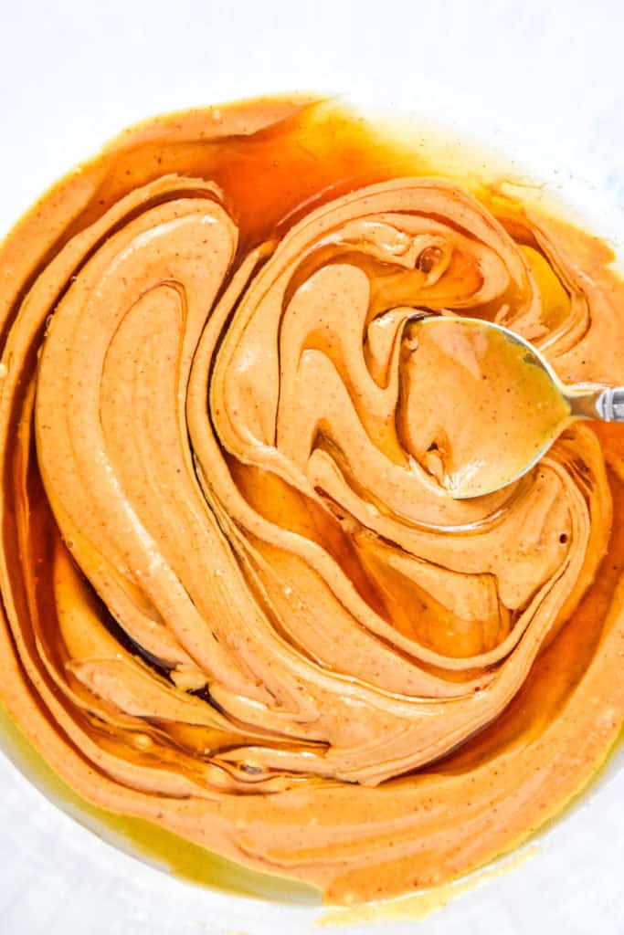 close up of mixing honey and peanut butter together.