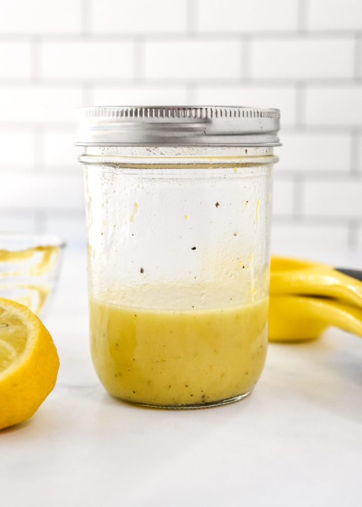 lemon olive oil vinaigrette dressing in a mason jar.