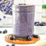 peanut butter powder blueberry cinnamon smoothie with fresh blueberries.