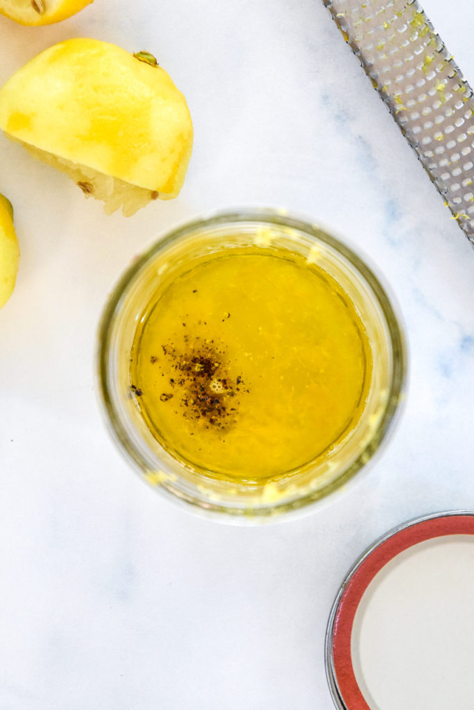 lemon and oil in a mason jar before combining to make dressing.