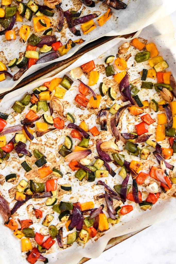 roasted vegetables on a sheet pan after cooking.