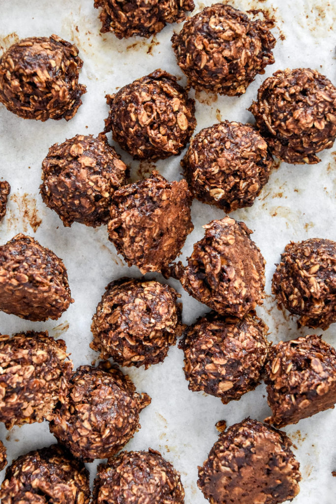 banana chocolate oatmeal cookie mounds on parchment paper.