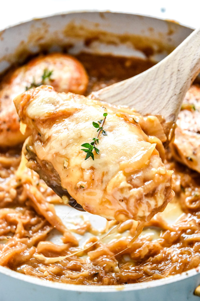 french onion baked chicken breast with cheese on top after baking.