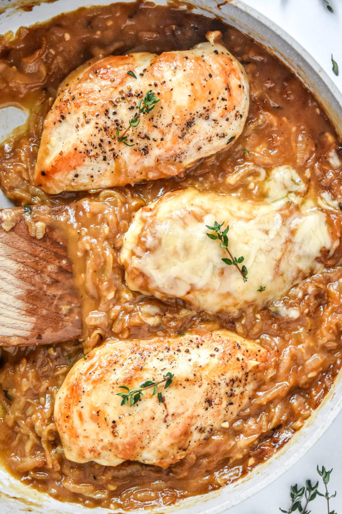 french onion baked chicken breasts in a skillet after baking.